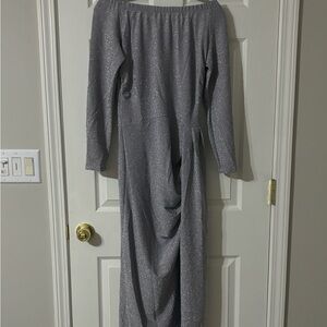 This beautiful silver sequence dress is gorgeous on!   Deep thigh slit.